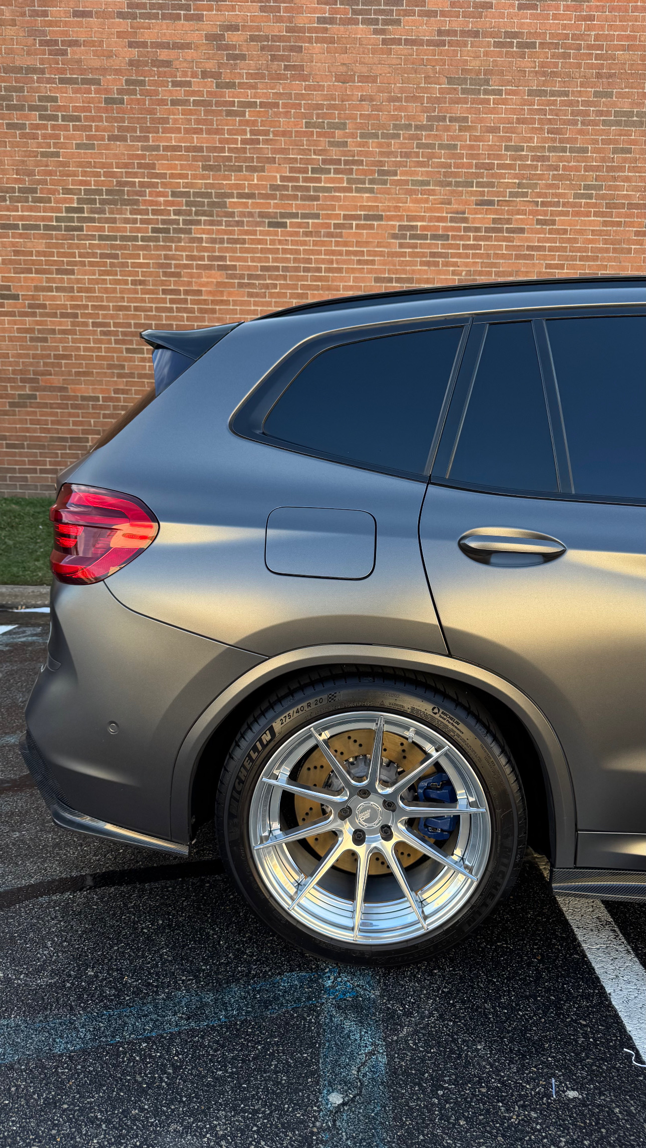 Gray BMW rear quarter and wheel